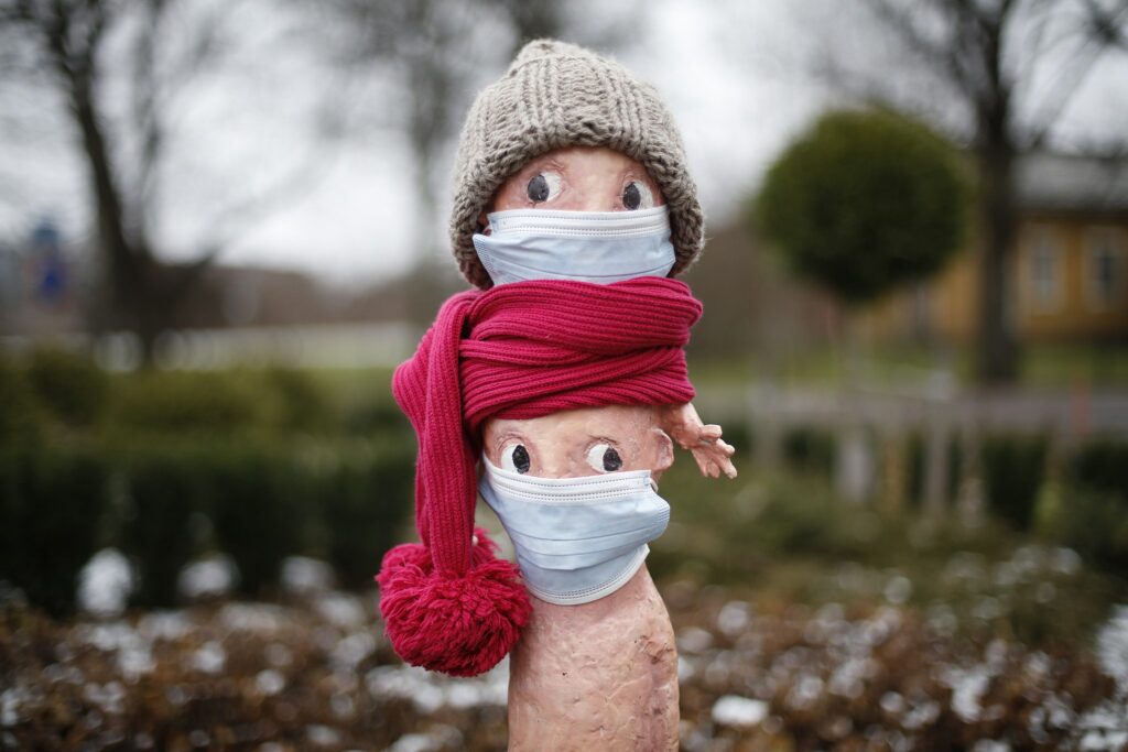 The lost statue with a beanie on his head and a face mask on his face