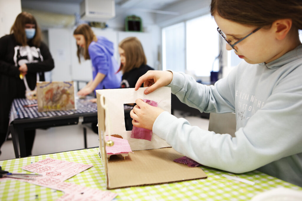 A lesson of the arts school's manual skills group.