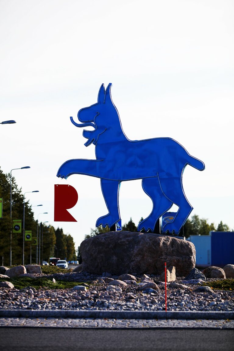 Ilves statue. A red R hangs from the paw.