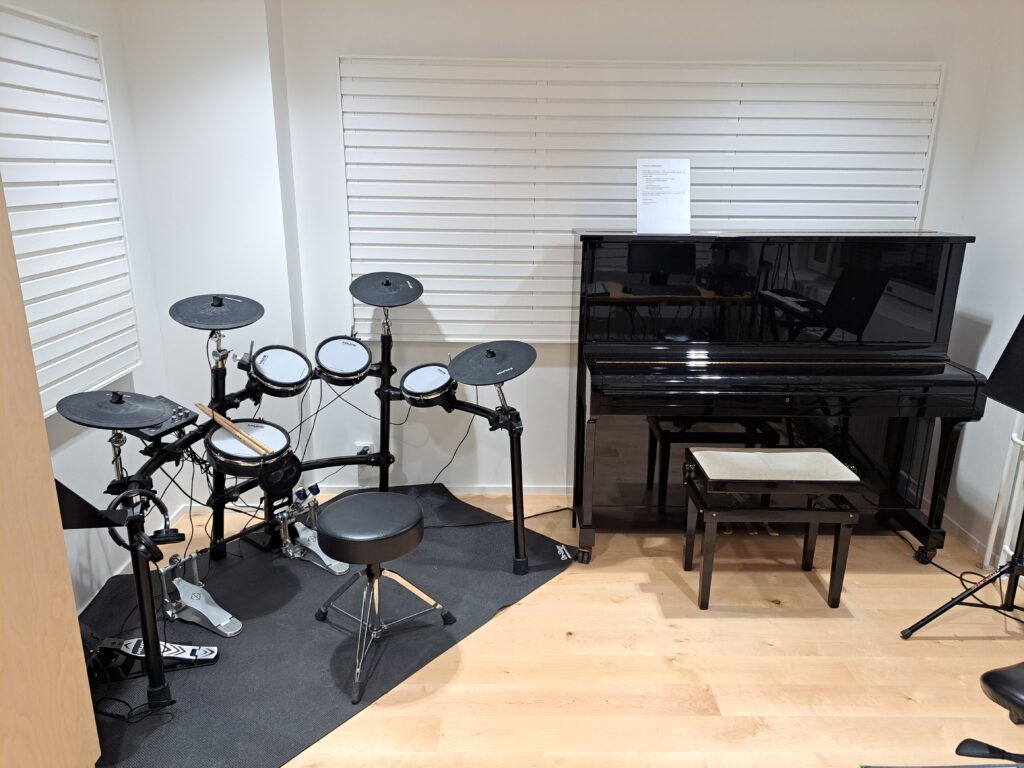 Music studio's electric drums and piano