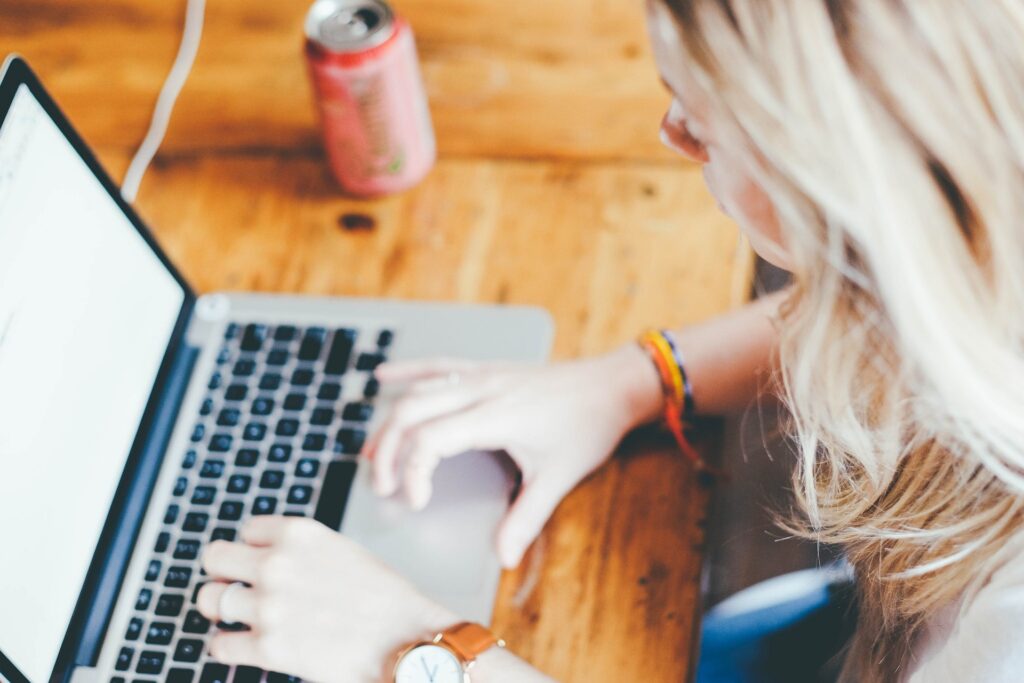 woman-keying-laptop-at-the-table.jpg