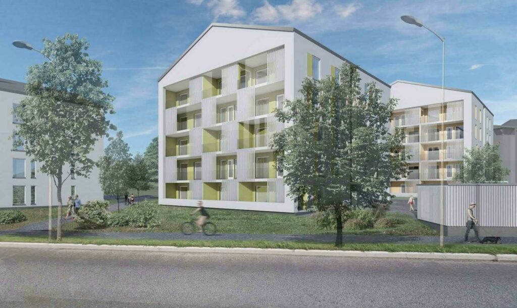 Observation picture, view from Kulmala puistokatu to the planning area. The 4- and 5-story new apartment buildings with light facades and gable roofs stick out from behind the lower outdoor equipment warehouses. It's a sunny summer day, people are walking and cycling on the light traffic route and on the new footpath leading to Piikinmäki park. The picture has a green atmosphere.