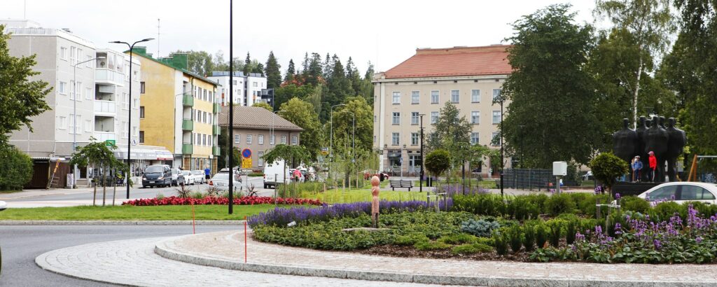 Traffic circle with flower plantings and the Lost statue.