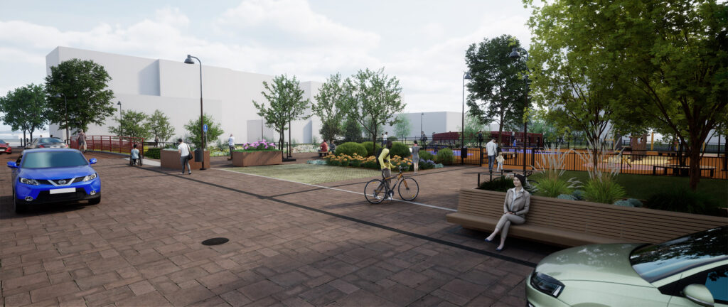 A view of Kanavakatu and Jokipuisto, with a shared street space paved with red concrete stone in front, planter boxes and benches, and a fenced playground behind.