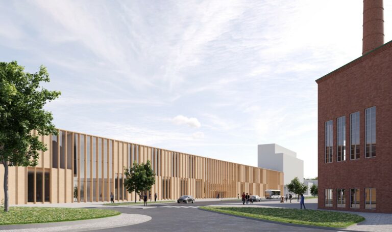 Havainnekuva: Näkymä Eteläisen Asemakadun ja Paloheimonkadun kiertoliittymältä kohti uutta HAMKin kampusta. On puolipilvinen kesäpäivä. Ihmisiä kuljeskelee katuympäristössä.